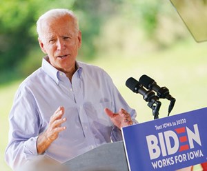 President Joe Biden behind podium giving a speech